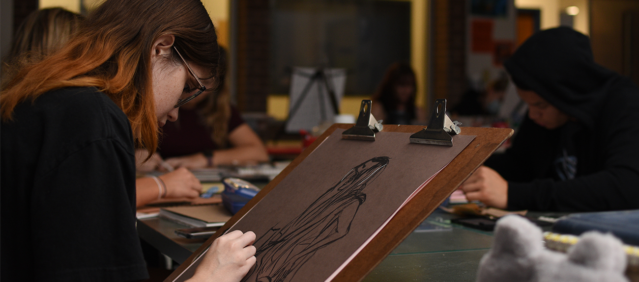 Charcoal Drawing Student drawing in Art Class
