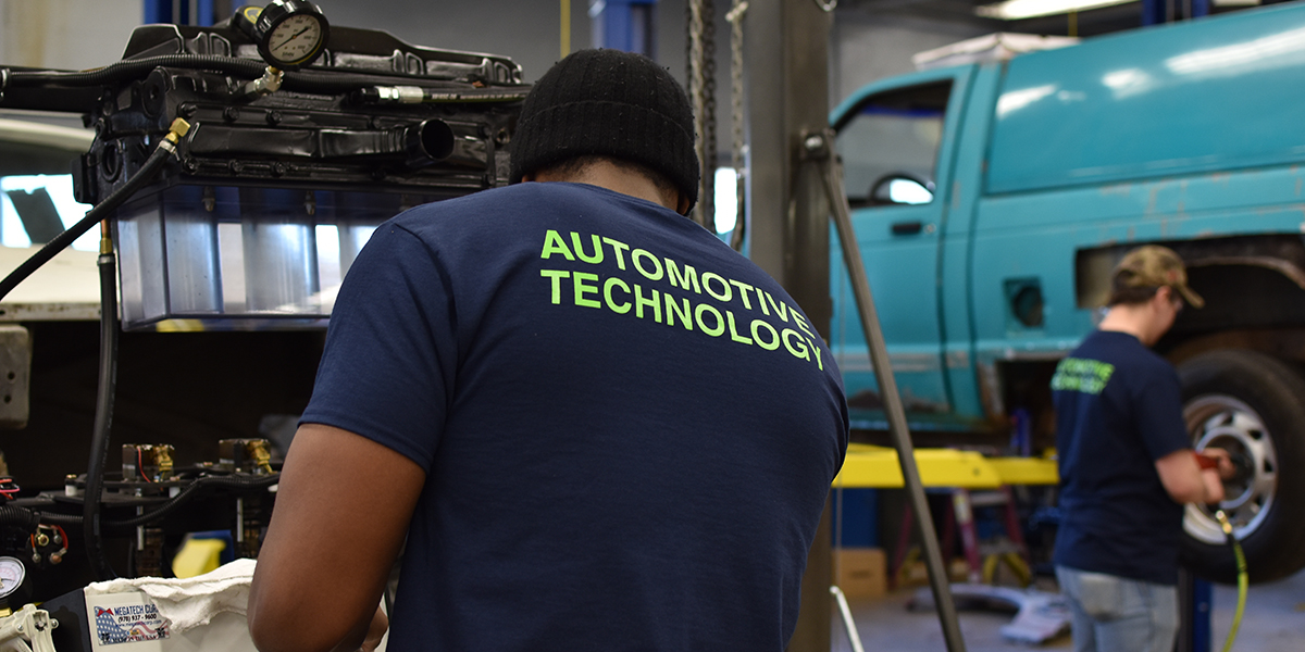 Student working on Car