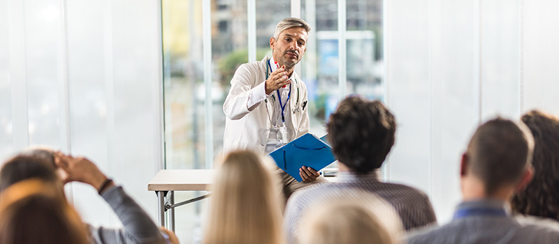 Doctor talking to a group of people