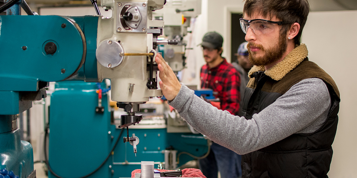 Student working in machining environment
