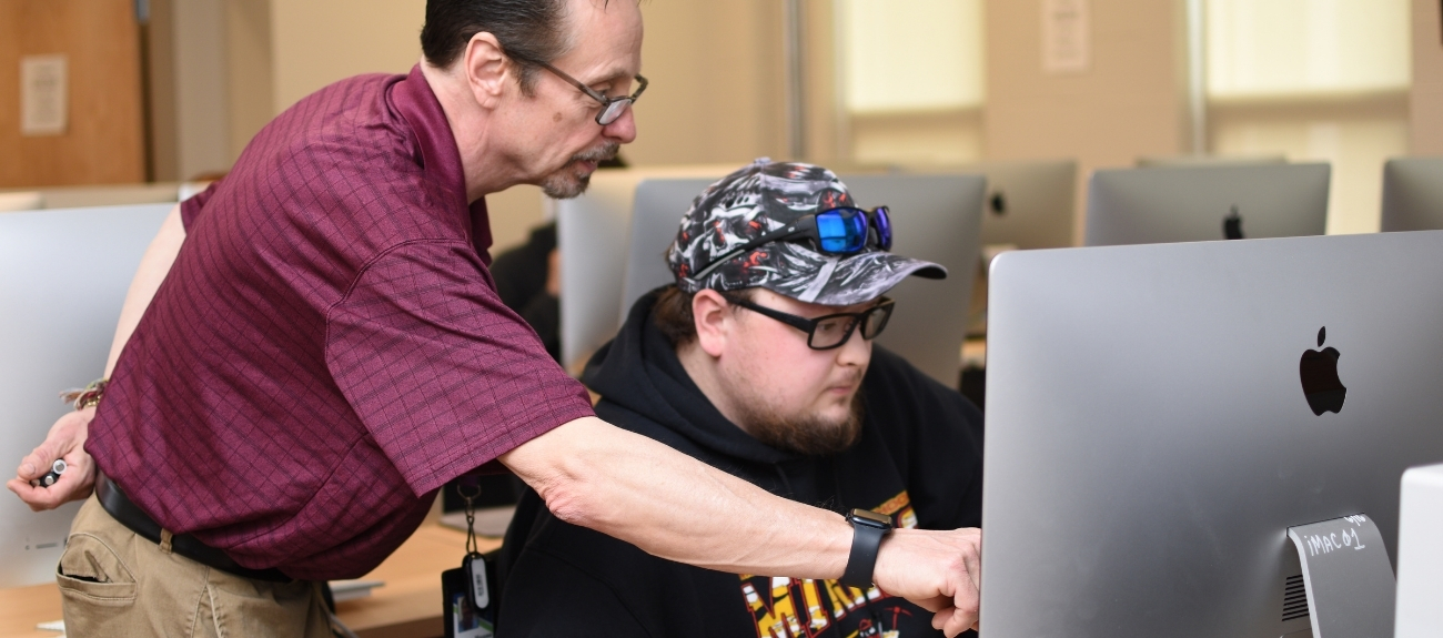 Instructor helping a Student