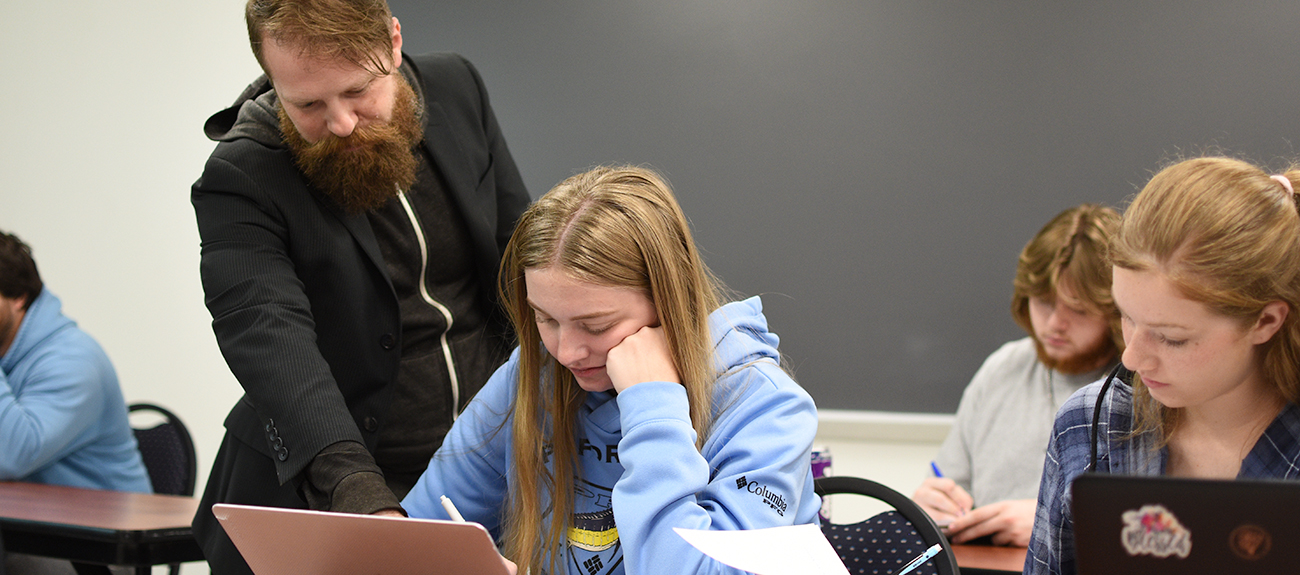 English Instructor teaching student