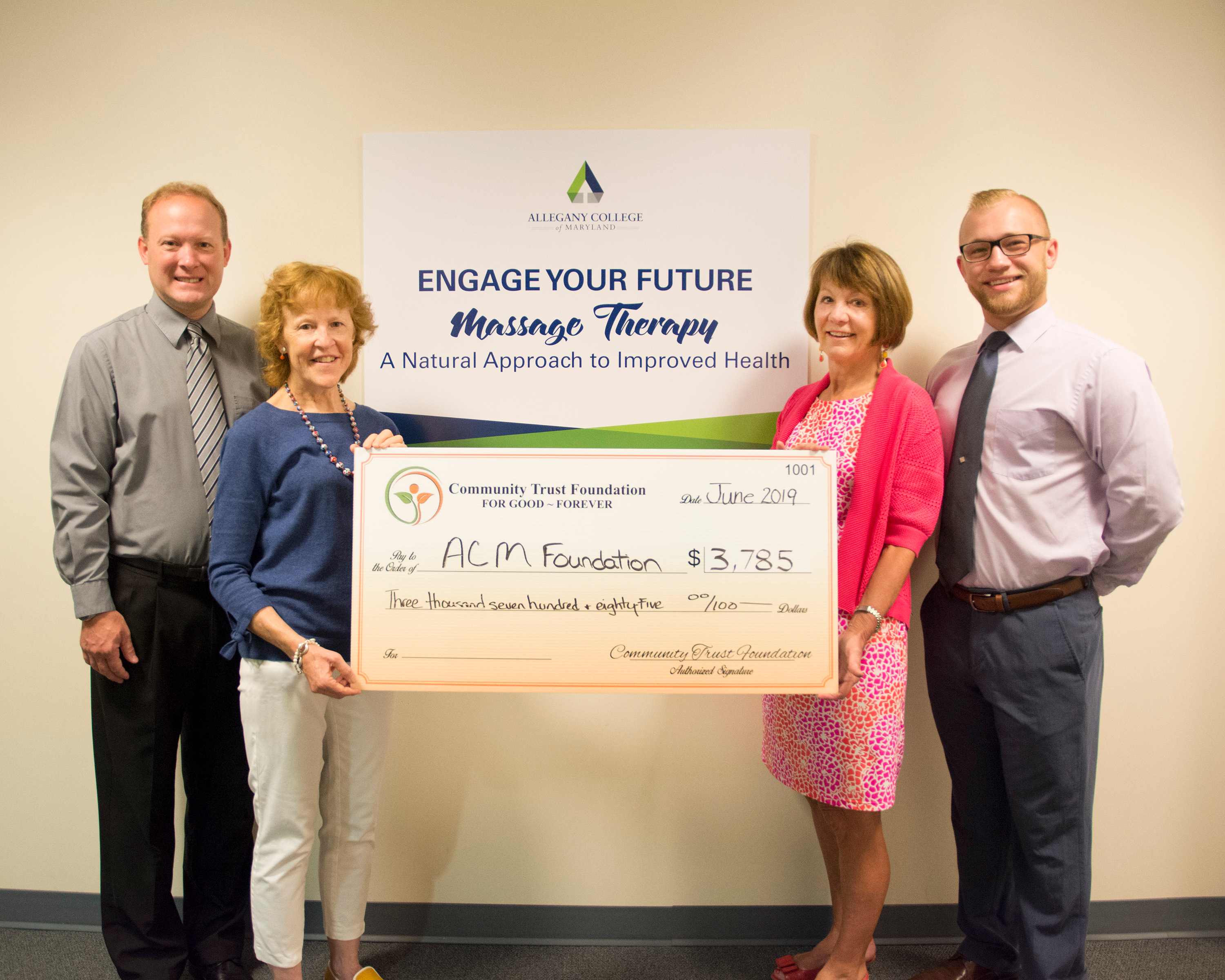 Massage Therapy receiving Foundation check