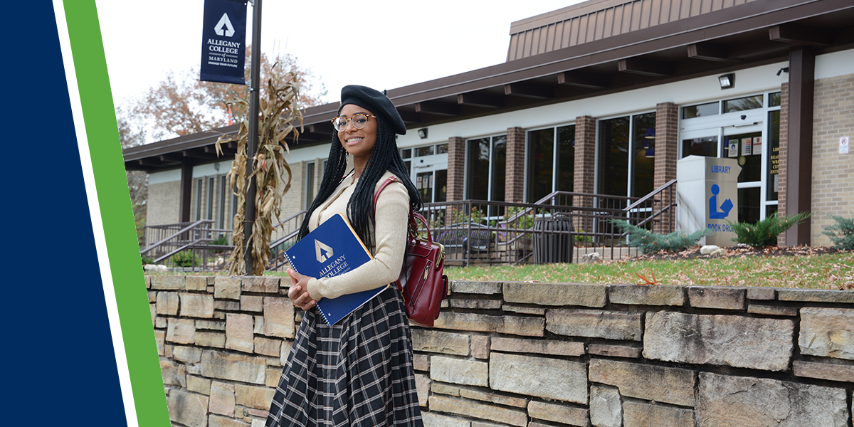 Student holding binder