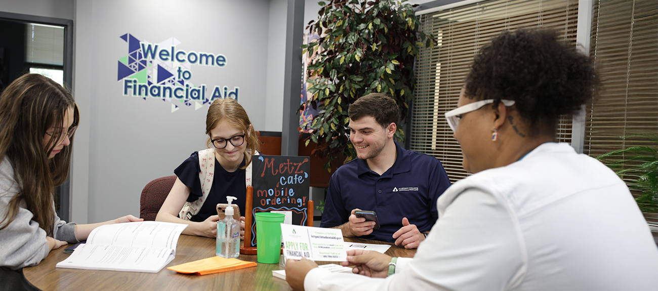 Financial Aid Month Students sitting in the Financial Aid office