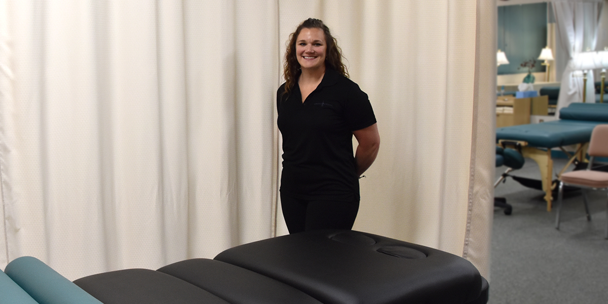 Massage Student standing by table
