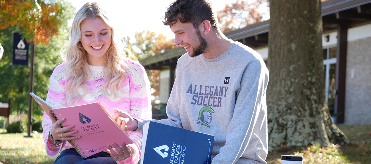 Students looking at ACM Books