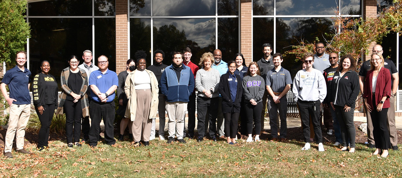 Transfer Fair College Recruiters standing infront of the College Center