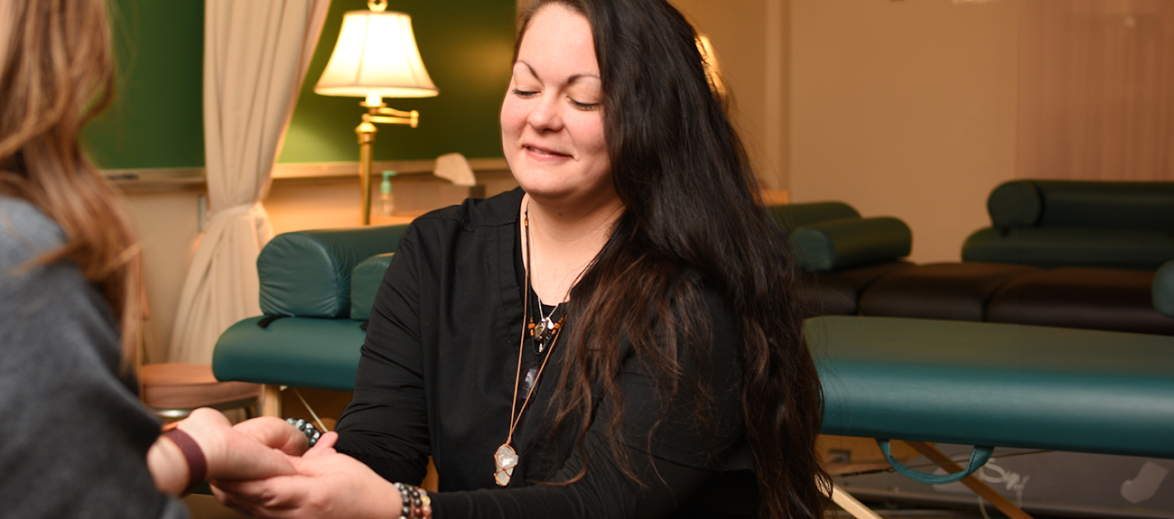 Massage Student massaging a clients hand