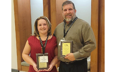 ACM student and faculty holding CCHA awards