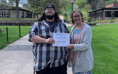 Scholarship recipient CJ Snyder with Tara DeVore, Pathways director