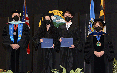 Graduates with leadership at Grad Walk graduates with leadership at Grad Walk