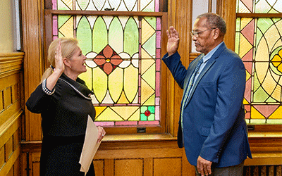 Trustee Eugene Frazier being sworn in