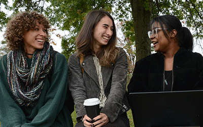 Trio of students outdoors at main campus