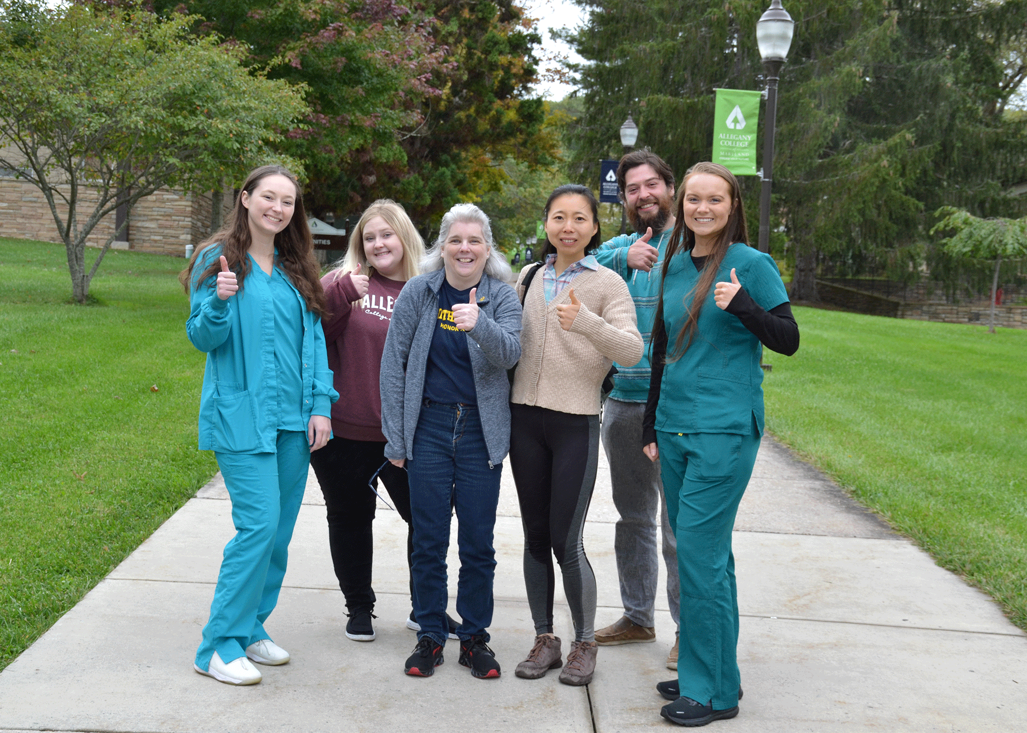 Group of ACM students giving thumbs up