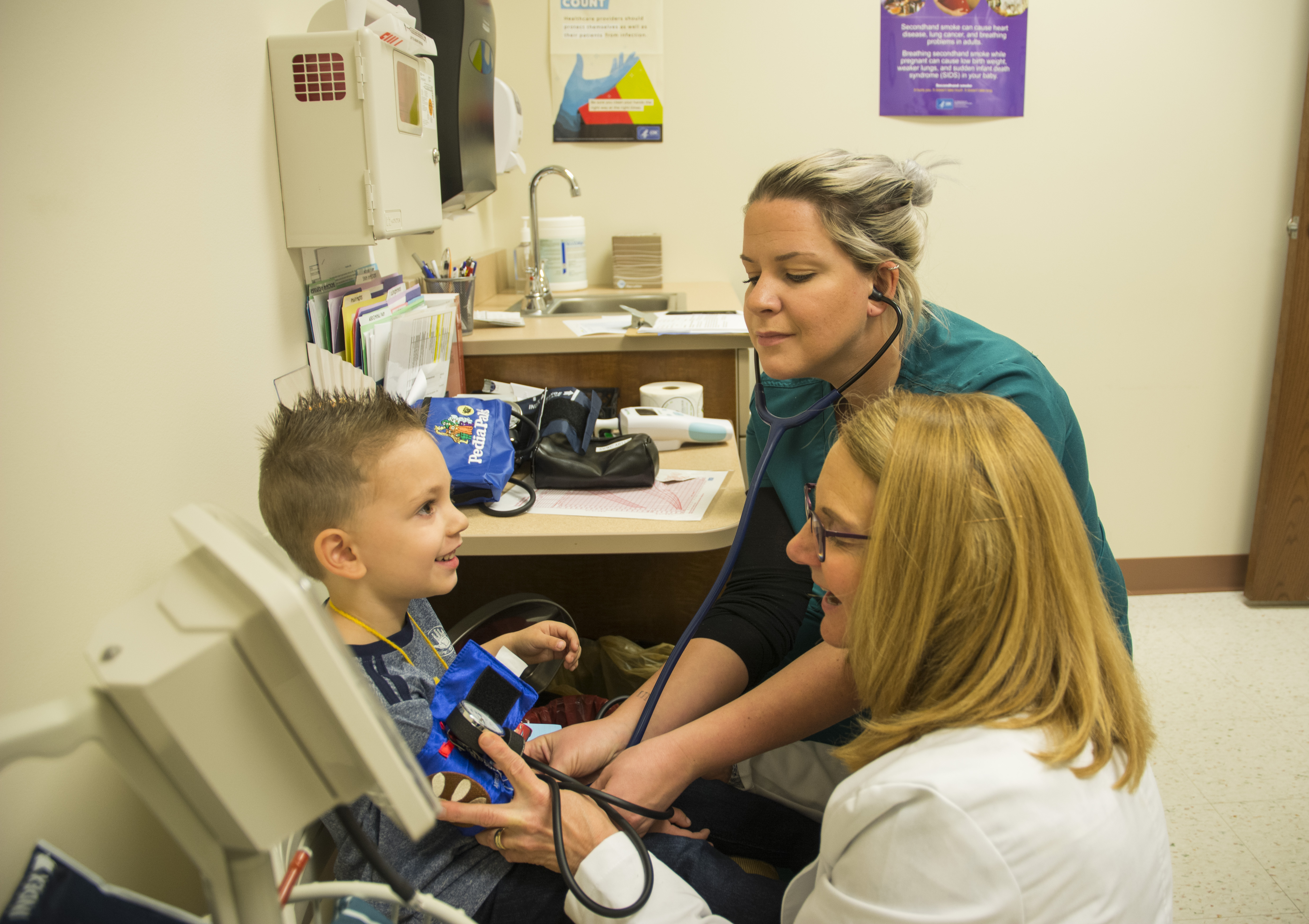 instructor, student, and young patient