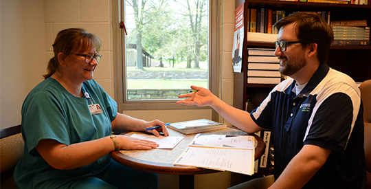 Employee talking to Student